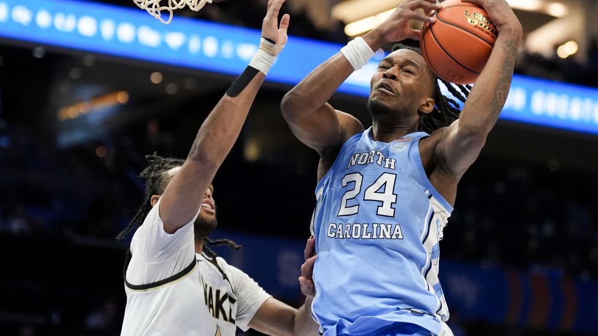 North Carolina forward Jae'Lyn Withers pull a rebound away from Wake Forest forward Efton Reid III during the second half of an NCAA college basketball game in the quarterfinals of the Atlantic Coast Conference tournament, Thursday, March 13, 2025, in Charlotte, N.C.