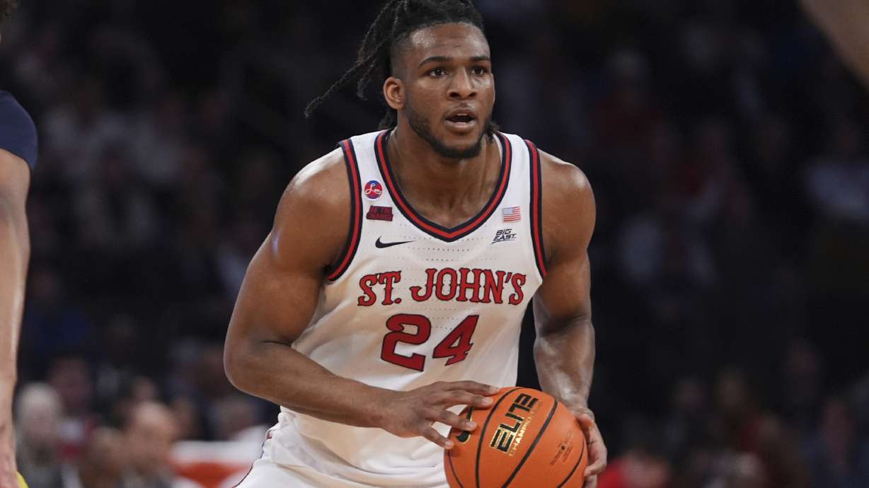 St. John's's Zuby Ejiofor (24) looks to pass during the first half of an NCAA college basketball game against the Marquette in the semifinals of the Big East tournament Friday, March 14, 2025, in New York.