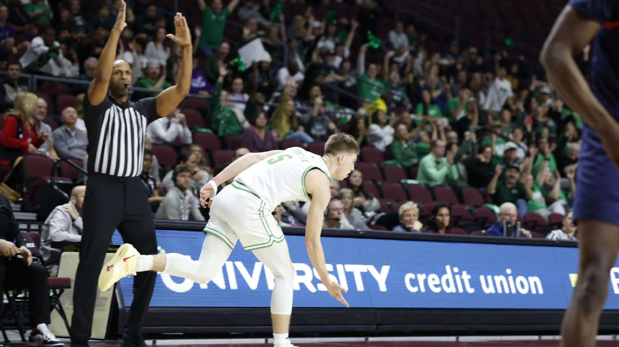 Tanner Toolson hits a 3-pointer and shows off a celebration.