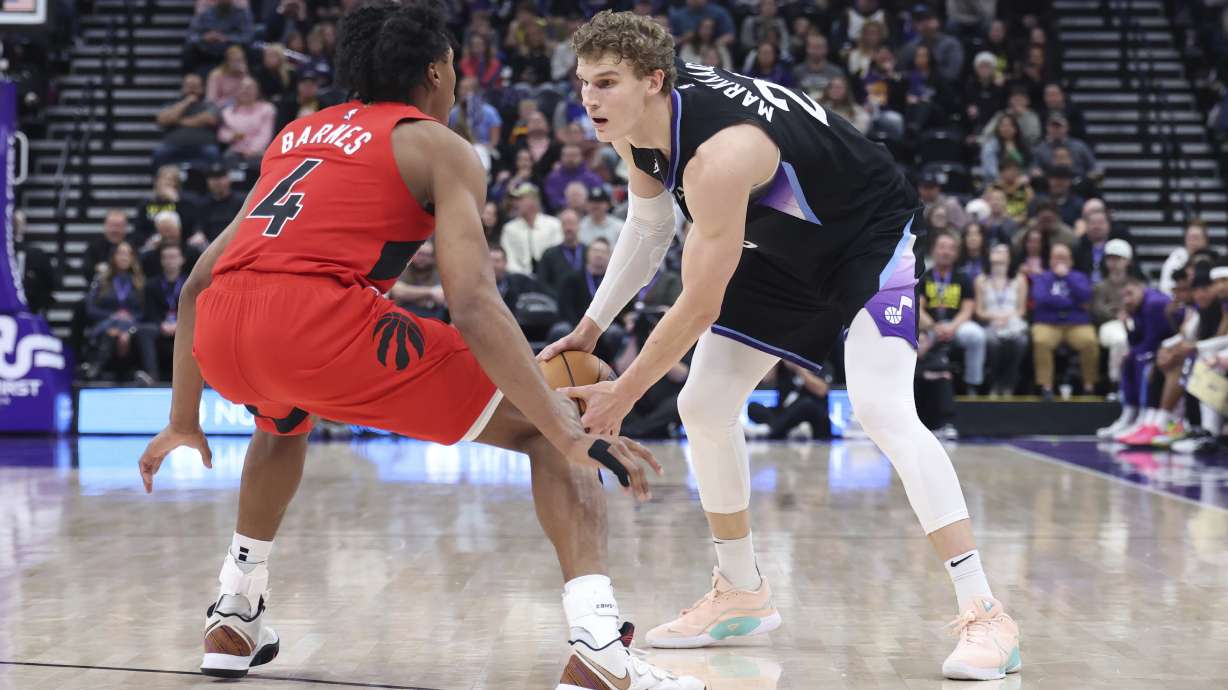 Utah Jazz forward Lauri Markkanen (23) looks for a play against Toronto Raptors forward Scottie Barnes (4) during the first half of an NBA basketball game, Friday, March 14, 2025, in Salt Lake City.
