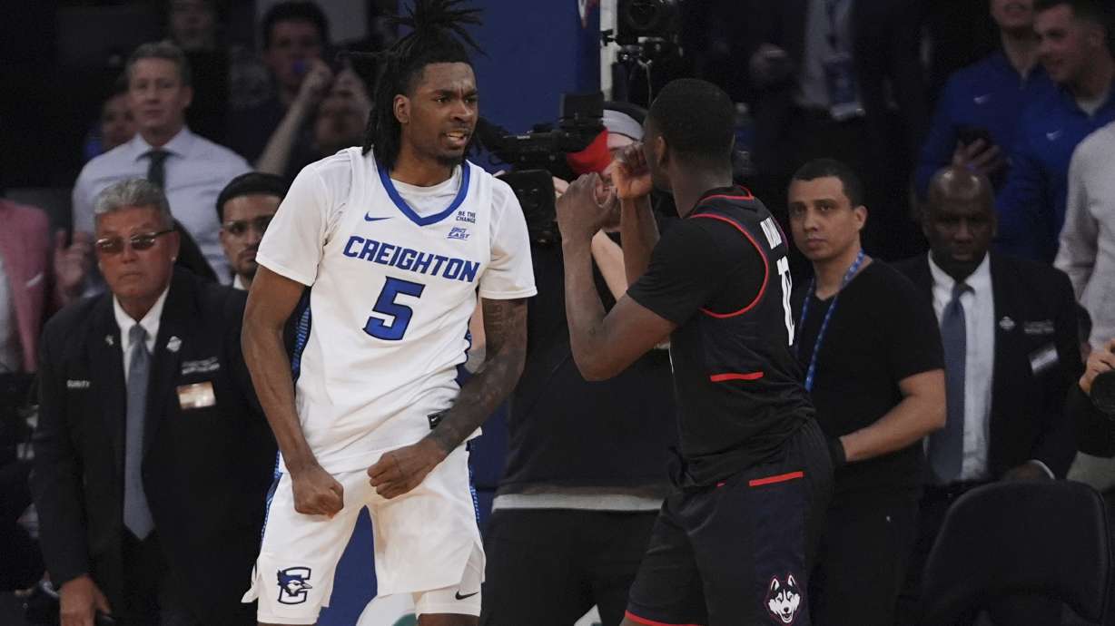 Creighton's Jamiya Neal (5) exchanges words with UConn's Hassan Diarra (10) during the second half of an NCAA college basketball game in the semifinals of the Big East tournament Friday, March 14, 2025, in New York.