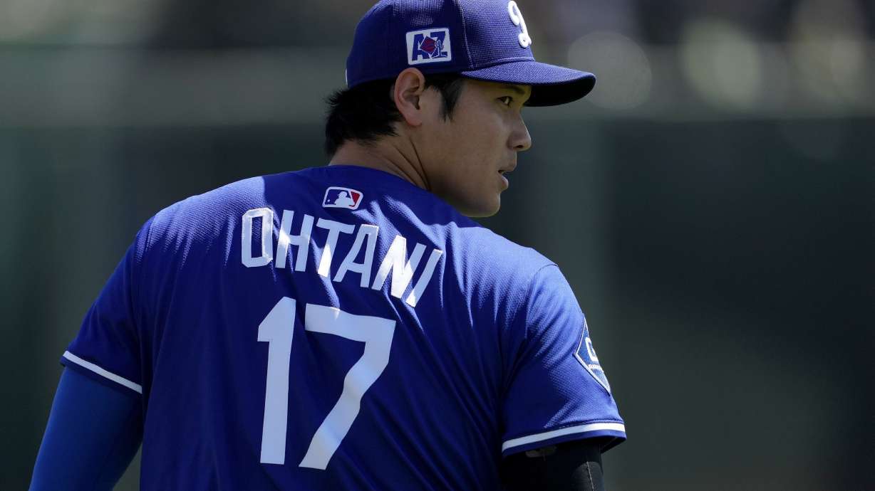 Los Angeles Dodgers' Shohei Ohtani warms up prior to a spring training baseball game against the Arizona Diamondbacks, Monday, March 10, 2025, in Phoenix.