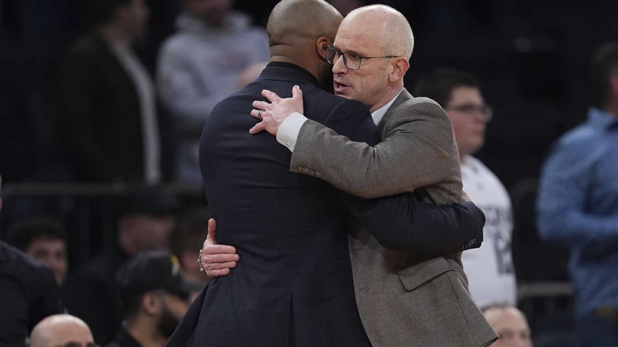 UConn head coach Dan Hurley, right, hugs Villanova head coach Kyle Neptune after an NCAA college basketball game at the Big East basketball tournament Thursday, March 13, 2025, in New York.