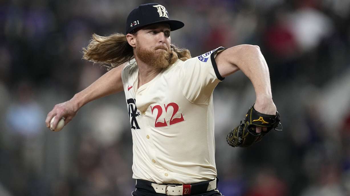 FILE - Texas Rangers starting pitcher Jon Gray throws to the Oakland Athletics in the first inning of a baseball game, Friday, Aug. 30, 2024, in Arlington, Texas.