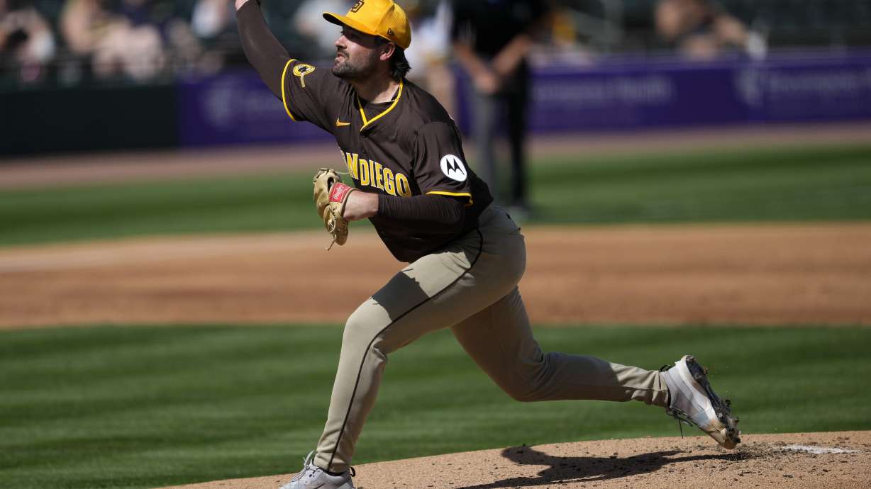 San Diego Padres pitcher Matt Waldron throws against the Athletics during the first inning of a spring training baseball game, Thursday, Feb. 27, 2025, in Mesa, Ariz.