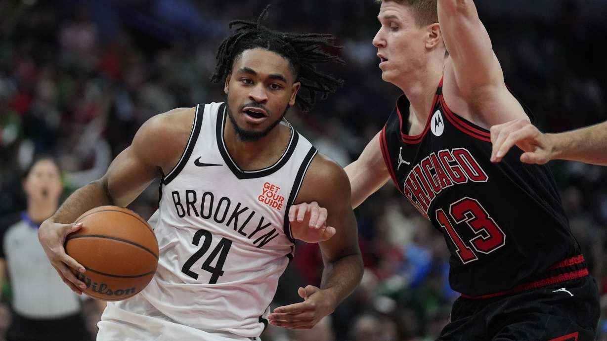 Chicago Bulls guard Kevin Huerter (13) guards against Brooklyn Nets guard Cam Thomas (24) during the first half of an NBA basketball game Thursday, March 13, 2025, in Chicago.