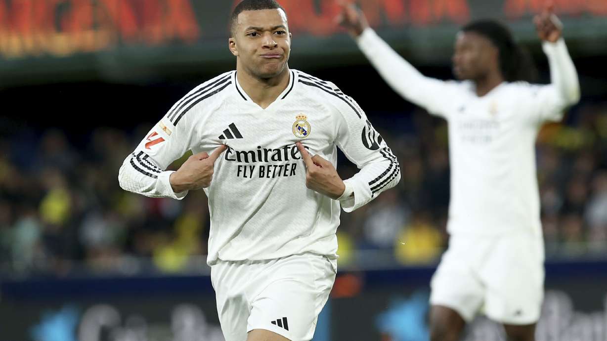 Real Madrid's Kylian Mbappe celebrates after scoring his side's second goal during a Spanish La Liga soccer match between Villarreal and Real Madrid in Villarreal, Spain, Saturday, March 15, 2025.