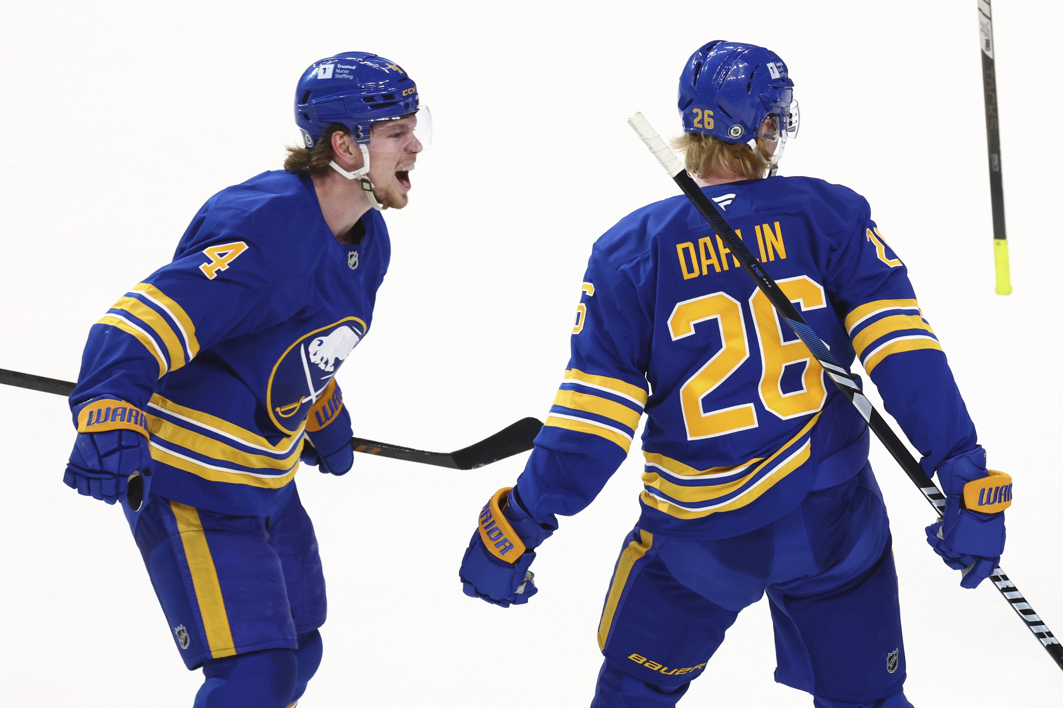Buffalo Sabres defenseman Rasmus Dahlin (26) celebrates his goal with defenseman Bowen Byram (4) during the third period of an NHL hockey game against the Vegas Golden Knights, Saturday, March 15, 2025, in Buffalo, N.Y.