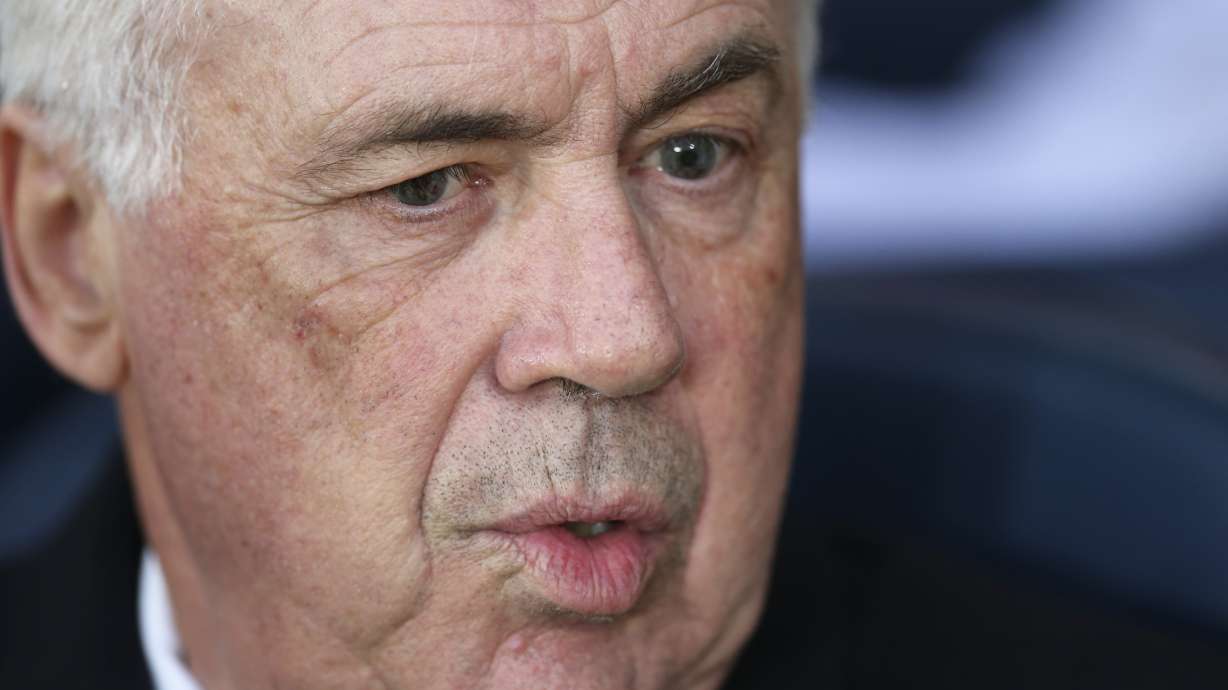 Real Madrid's head coach Carlo Ancelotti sits on the bench before a Spanish La Liga soccer match between Villarreal and Real Madrid in Villarreal, Spain, Saturday, March 15, 2025.