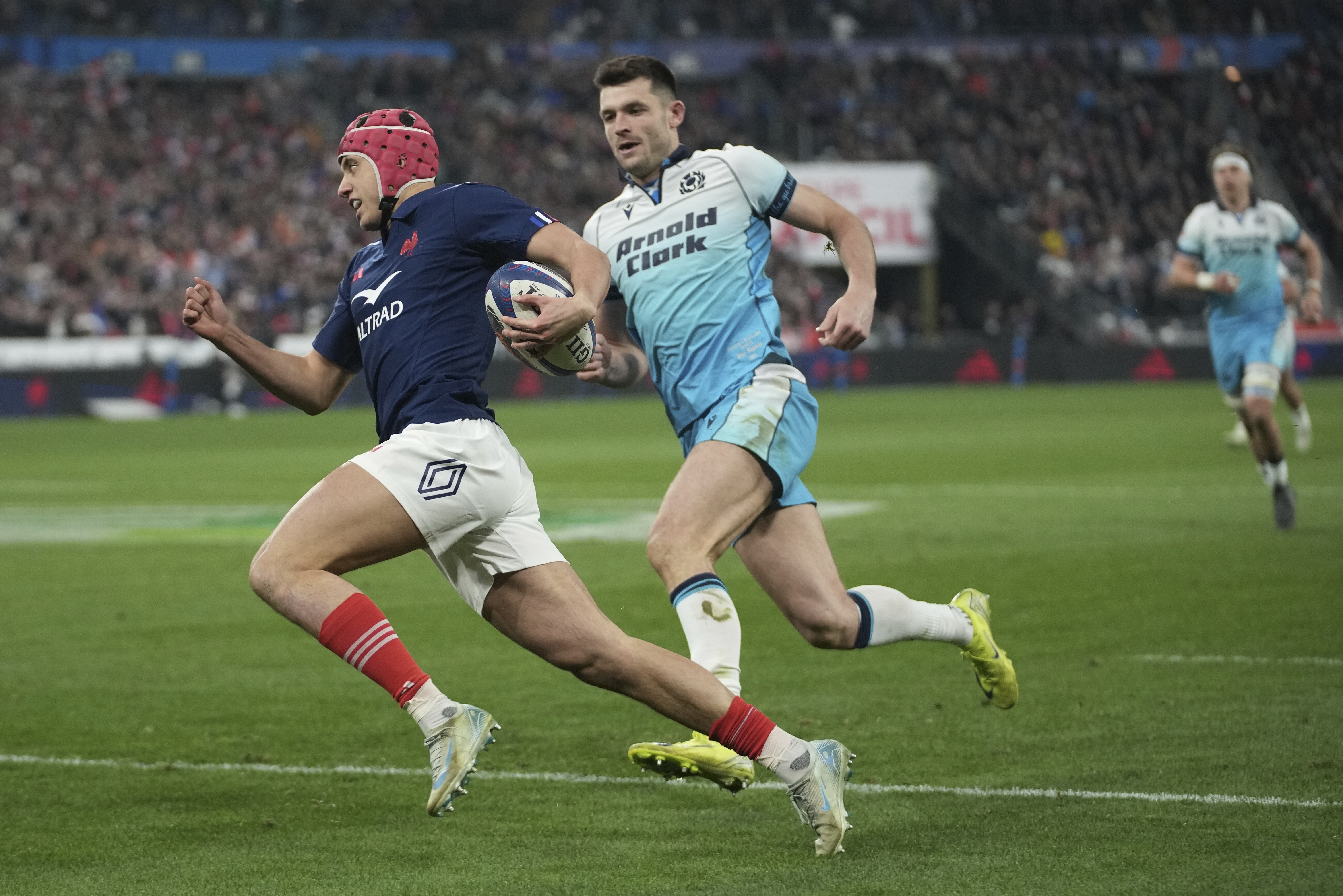 France's Louis Bielle-Biarrey races in to score a try during the Six Nations rugby union match between France and Scotland at the Stade de France in Saint-Denis, outside Paris, Saturday, March 15, 2025.