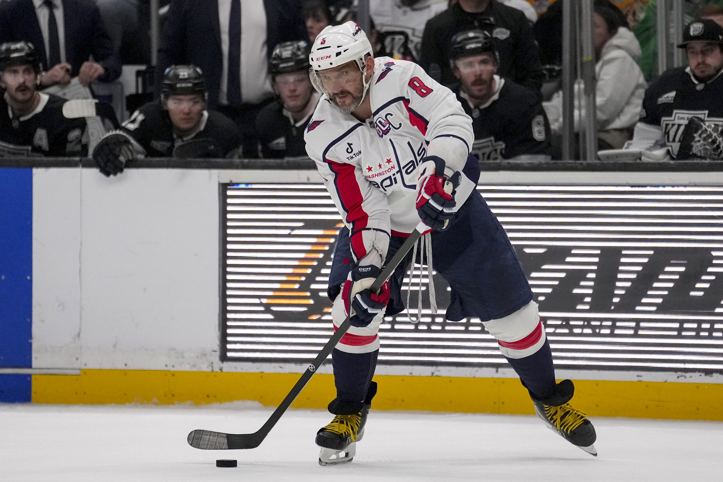 Washington Capitals left wing Alex Ovechkin (8) passes the puck during the third period of an NHL hockey game against the Los Angeles Kings Thursday, March 13, 2025, in Los Angeles.