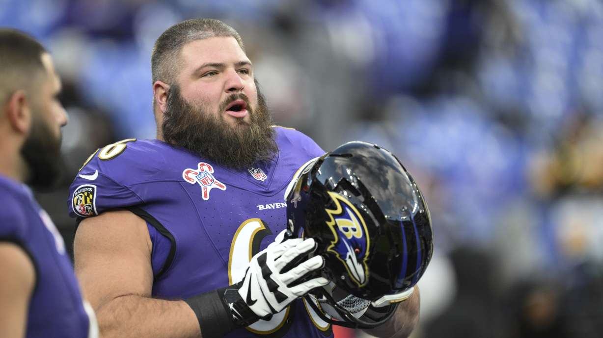 FILE - Baltimore Ravens guard Ben Cleveland looks on during pre-game warm-ups before an NFL football game against the Pittsburgh Steelers, Dec. 21, 2024, in Baltimore.