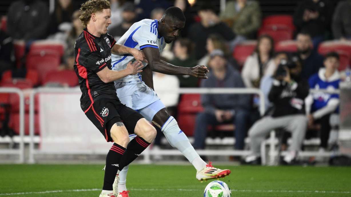 CF Montréal forward Prince Owusu, right, kicks the ball against D.C. United defender Kye Rowles, left, during the first half of an MLS soccer match, Saturday, March 15, 2025, in Washington.