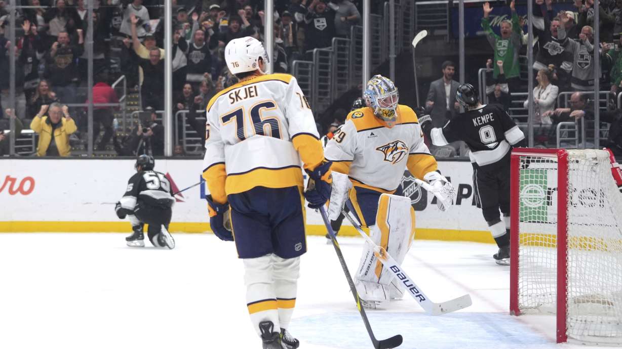 Nashville Predators goaltender Justus Annunen (29) and defenseman Brady Skjei (76) react as Los Angeles Kings right wing Quinton Byfield (55) celebrates his overtime goal in an NHL hockey game Saturday, March 15, 2025, in Los Angeles.