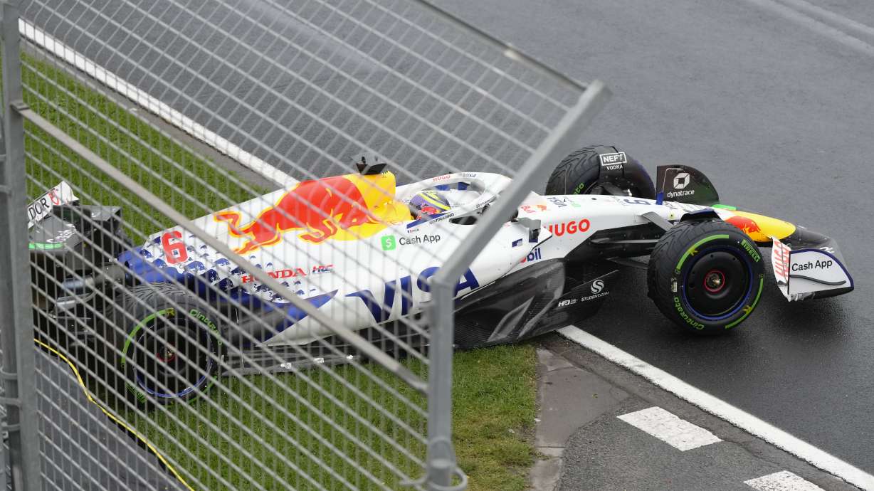 Team RB driver Isack Hadjar of France sits in his car after hitting the wall in the formation lap ahead of the start the Australian Formula One Grand Prix at Albert Park, in Melbourne, Australia, Sunday, March 16, 2025.