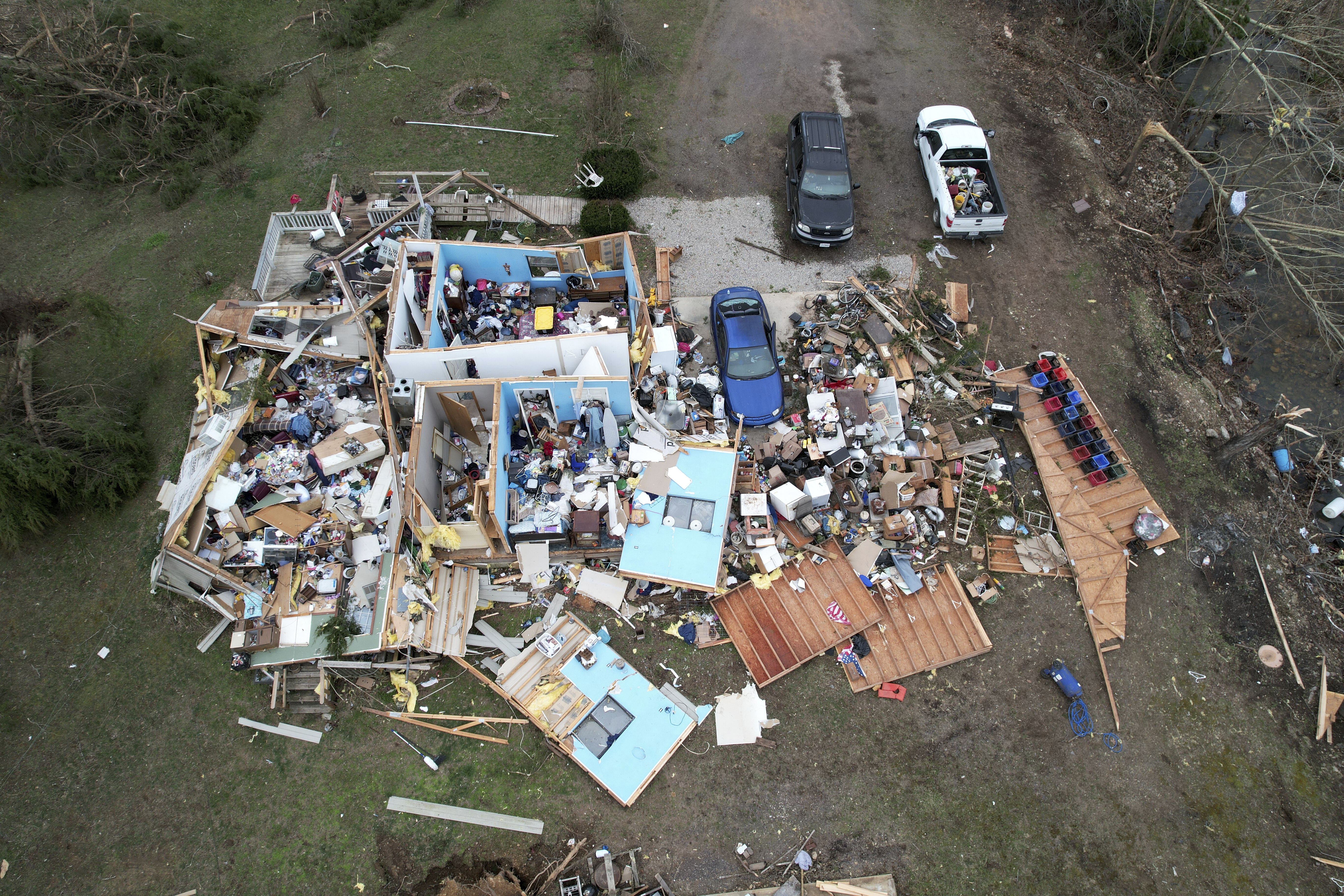 Tornadoes, wildfires and dust sweep across US as massive storm leaves at least 33 dead