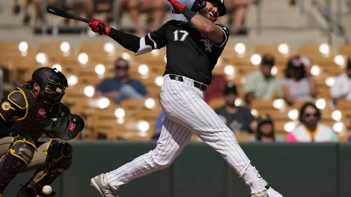 Chicago White Sox's Joey Gallo reacts as he is called out on strikes during the second inning of a spring training baseball game, as San Diego Padres catcher Luis Campusano lookon, right, Wednesday, Feb. 26, 2025, in Phoenix.