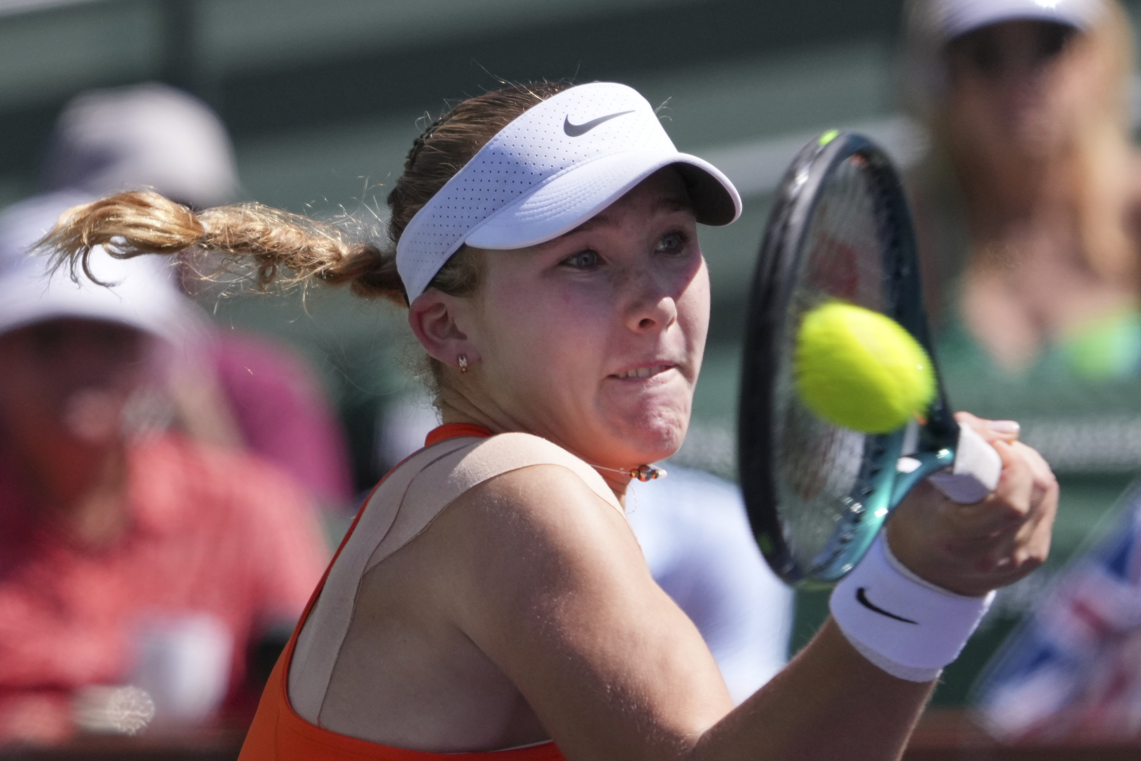 Mirra Andreeva, of Russia, returns to Aryna Sabalenka, of Belarus, during the final match at the BNP Paribas Open tennis tournament Sunday, March 16, 2025, in Indian Wells, Calif.