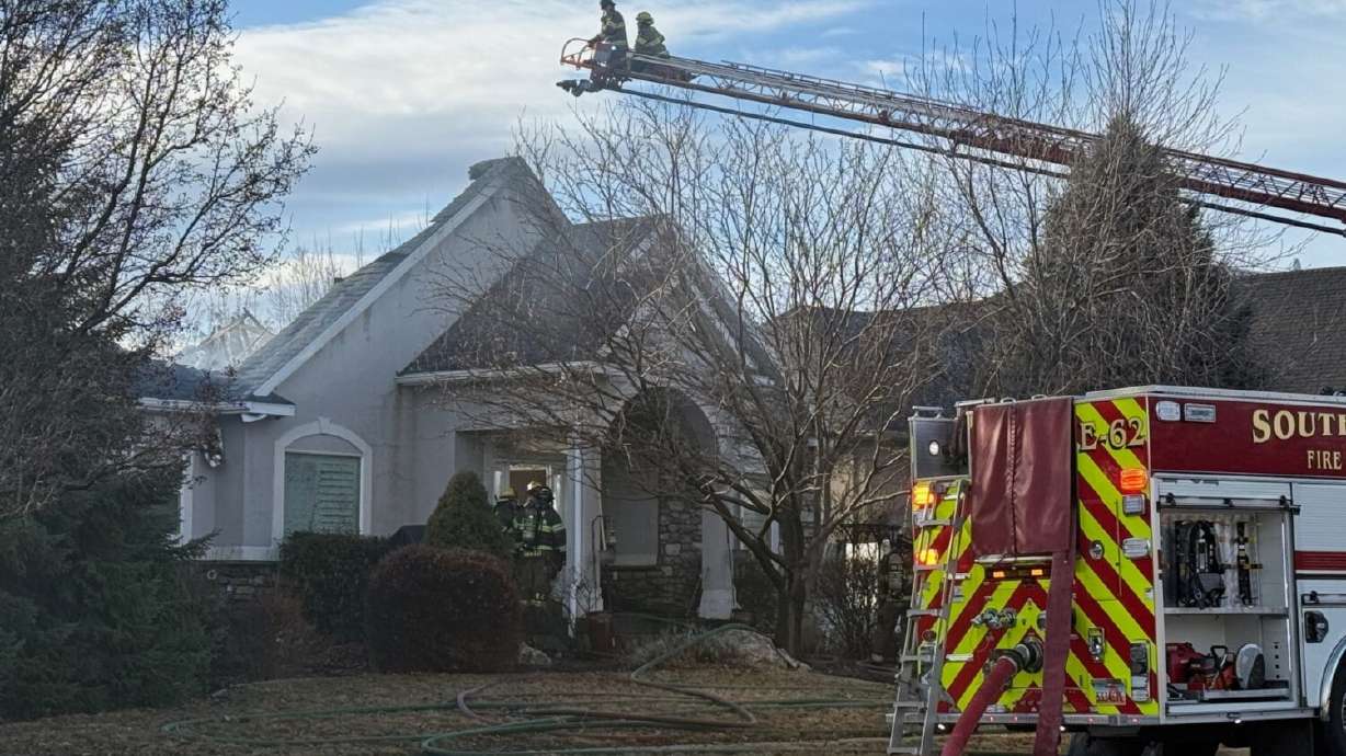 Crews worked to put out a South Jordan house fire on Sunday.