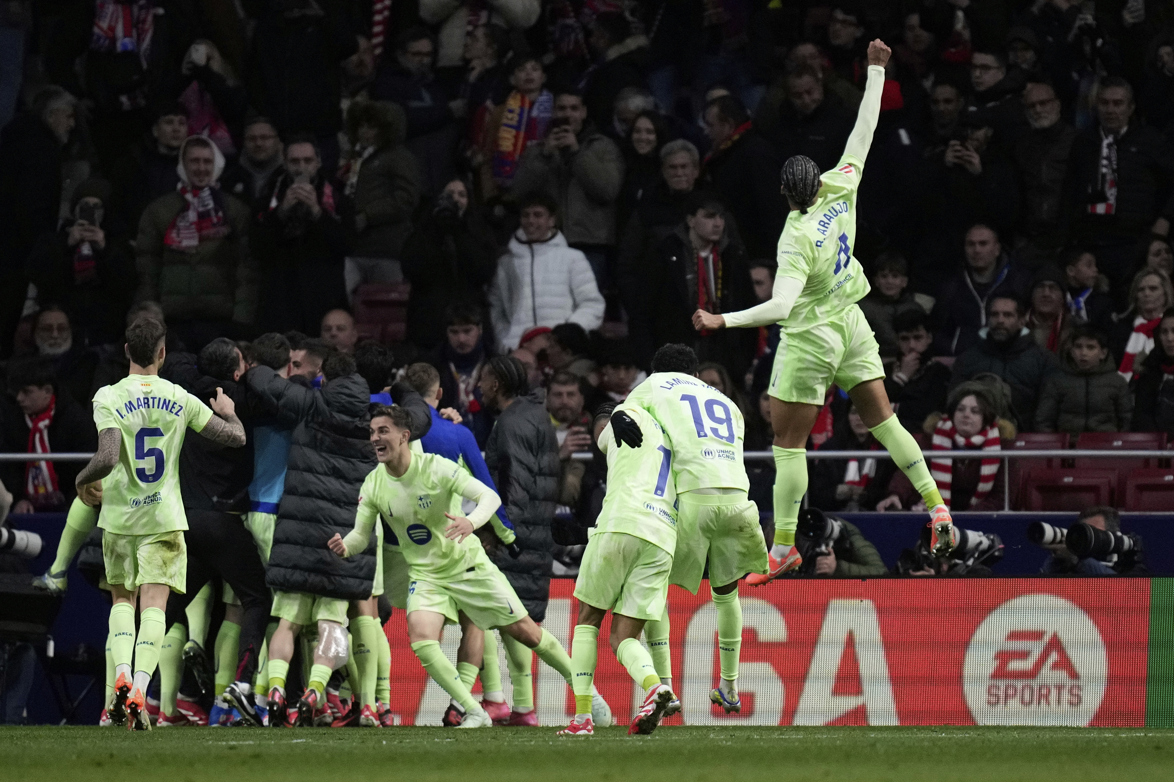 Barcelona's players celebrate their side's 4th goal scored by Ferran Torres during a La Liga soccer match between Atletico Madrid and FC Barcelona at the Metropolitano stadium in Madrid, Sunday, March 16, 2025.