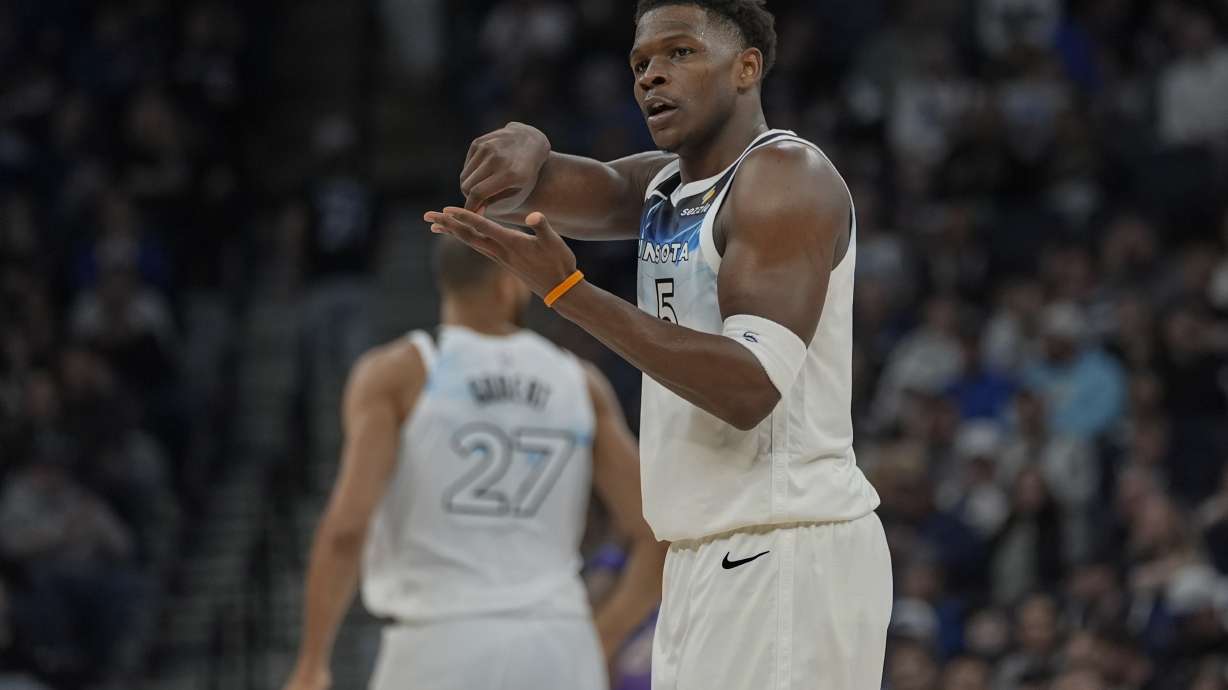 Minnesota Timberwolves guard Anthony Edwards (5) gestures after making a shot during the first half of an NBA basketball game against the Utah Jazz, Sunday, March 16, 2025, in Minneapolis.