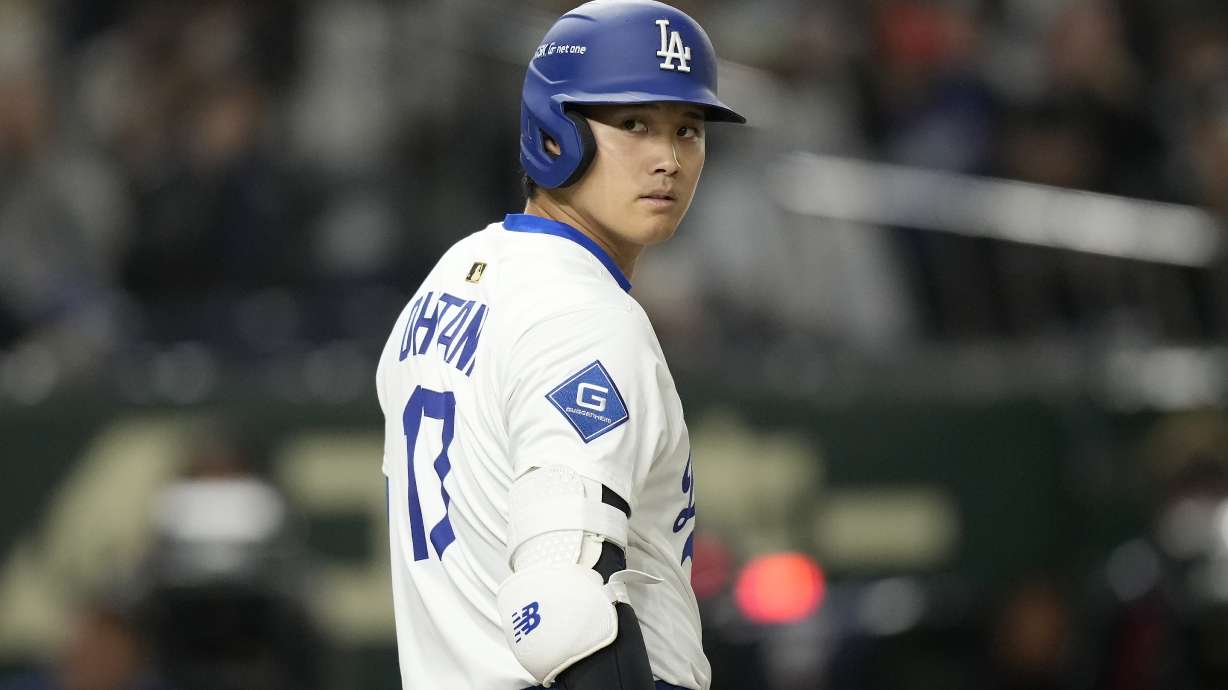 Los Angeles Dodgers' Shohei Ohtani (17) walks on the field during the first inning in an MLB Japan Series exhibition baseball game against the Hanshin Tigers, Sunday, March 16, 2025, in Tokyo.