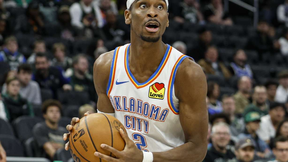 Oklahoma City Thunder's Shai Gilgeous-Alexander looks to pass the ball against the Milwaukee Bucks during the second half of an NBA basketball game Sunday, March 16, 2025, in Milwaukee.