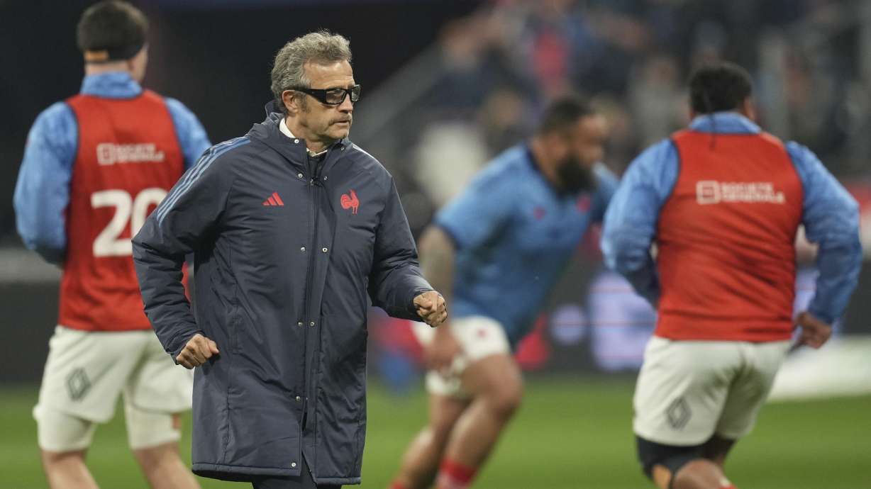 France's coach Fabien Galthie watches as he team warm-up before the Six Nations rugby union match between France and Scotland at the Stade de France in Saint-Denis, outside Paris, Saturday, March 15, 2025.