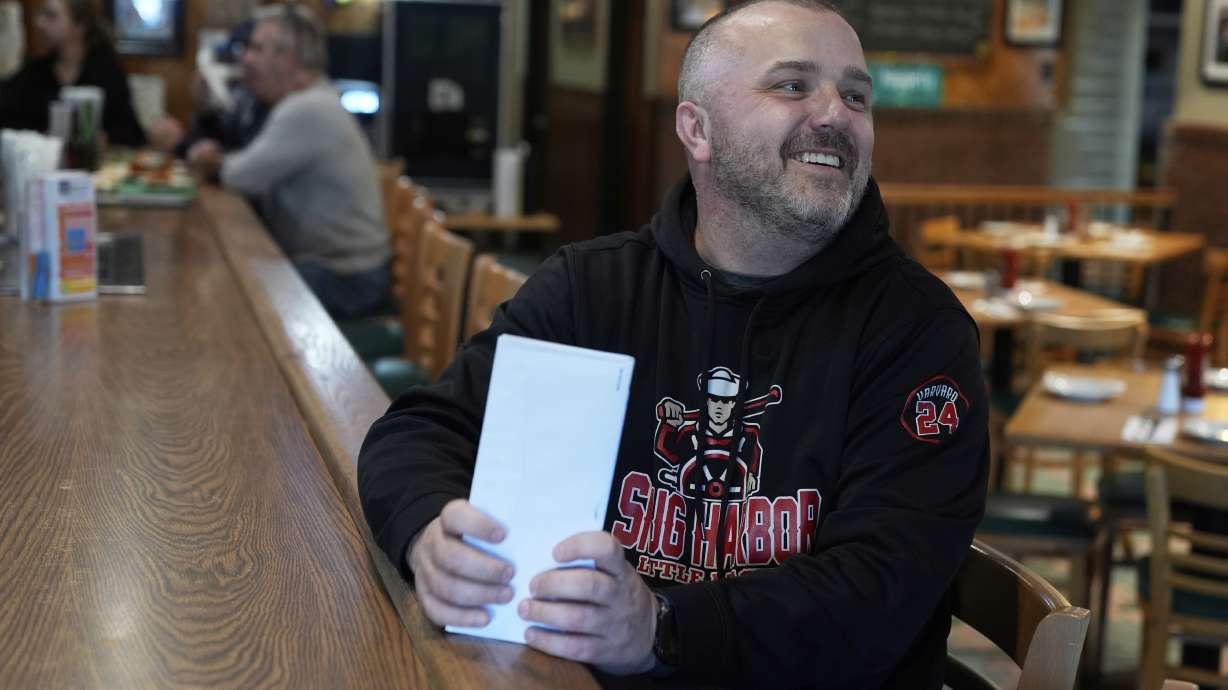 Terence Haggerty talks to customers in his family bar, Jody's Club Forest, in Staten Island, New York, Monday, March 10, 2025.