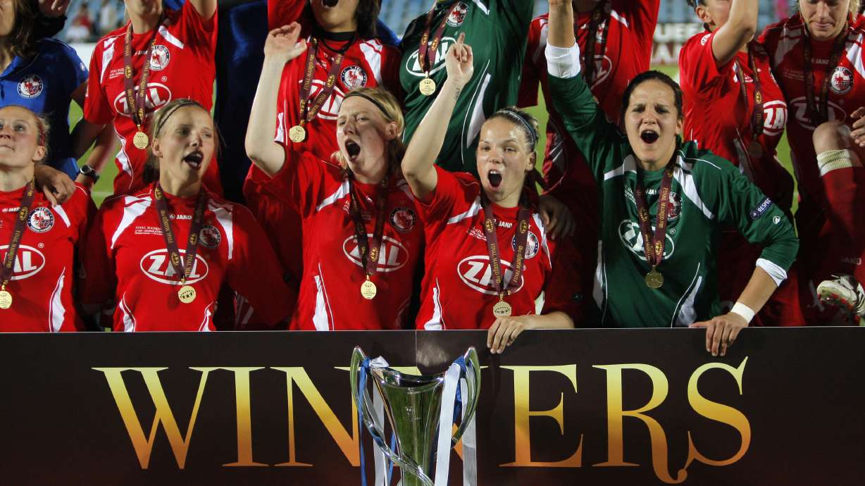 FILE - Turbine Potsdam players celebrate with the trophy after winning UEFA Women's Champions League Final soccer match against Lyon at the Coliseum Alfonso Perez stadium in Getafe, near Madrid, Thursday, May 20, 2010.