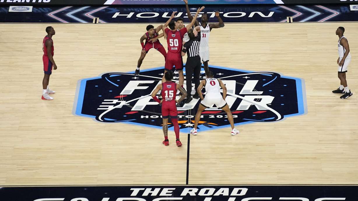 FILE - Florida Atlantic center Vladislav Goldin (50) and San Diego State forward Nathan Mensah (31) jump for the tipoff during the first half of a Final Four college basketball game in the NCAA Tournament on Saturday, April 1, 2023, in Houston.