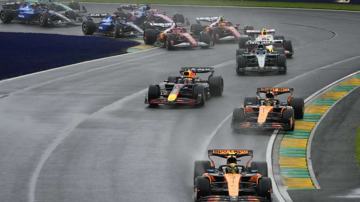 McLaren driver Lando Norris of Britain leads the field into turn two at the start of the Australian Formula One Grand Prix at Albert Park, in Melbourne, Australia, Sunday, March 16, 2025.