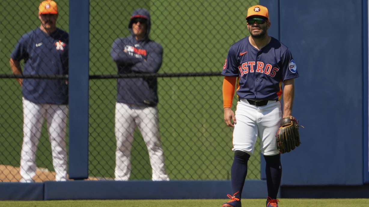 FILE - Houston Astros' Jose Altuve takes up his position in left field during the third inning of a spring training baseball game against the St. Louis Cardinals Friday, Feb. 28, 2025, in West Palm Beach, Fla.