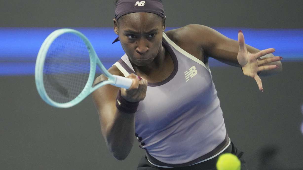FILE - Coco Gauff of the United States returns a shot to Yuliia Starodubtseva of Ukraine during the women's singles quarterfinals match of the China Open tennis tournament, at the National Tennis Center in Beijing, Oct. 3, 2024.