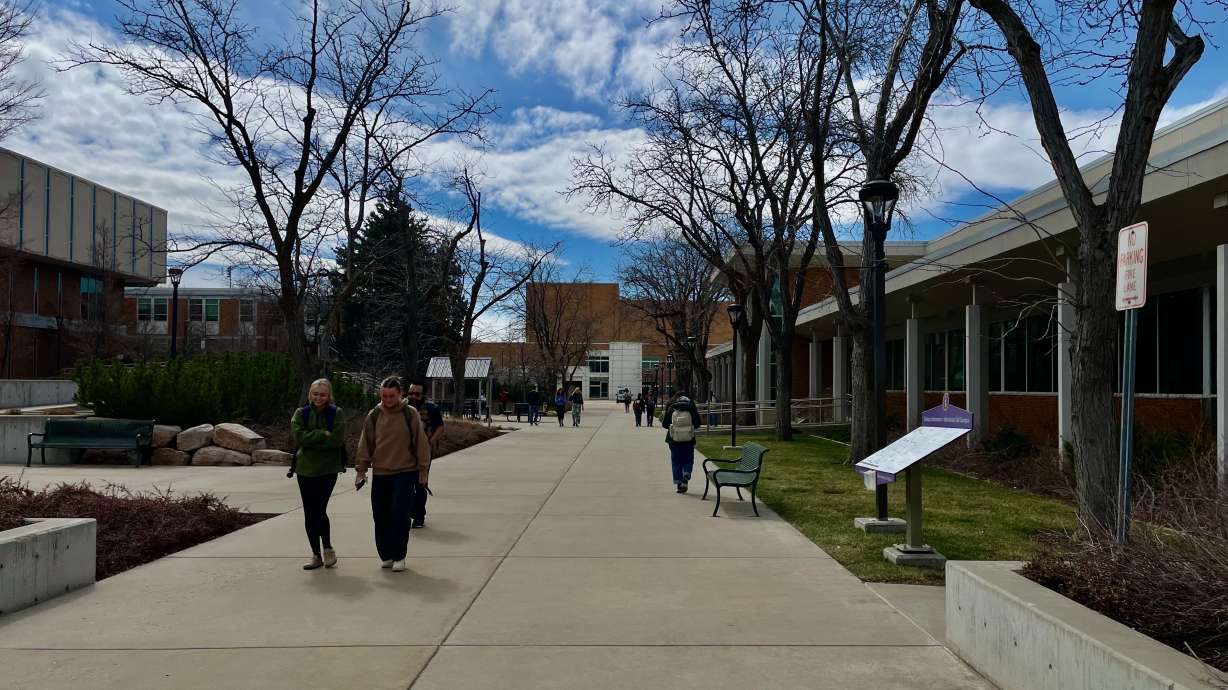 Details of Weber State's plans to reduce spending per legislation requiring cuts at eight institutions are emerging. In the photo from Monday, students walk through the campus of the Ogden school.
