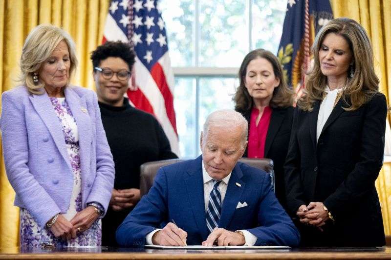 President Joe Biden signs a presidential memorandum that establishes a White House Initiative on Women's Health Research in the Oval Office of the White House, Nov. 13, 2023, in Washington.