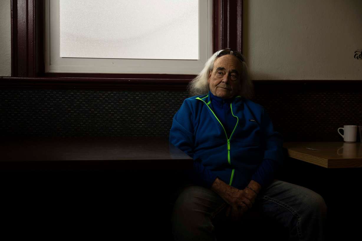 Pine, who has been sober since Dec. 18, 2010, poses for a portrait while sitting in the same spot he sits in at every Alcoholics Anonymous meeting, at the Alano Club in Murray on March 5. Pine says there’s nothing AA can’t give you; through AA, Pine has not only achieved sobriety but also learned to read at 65 and lost hundreds of pounds of weight.