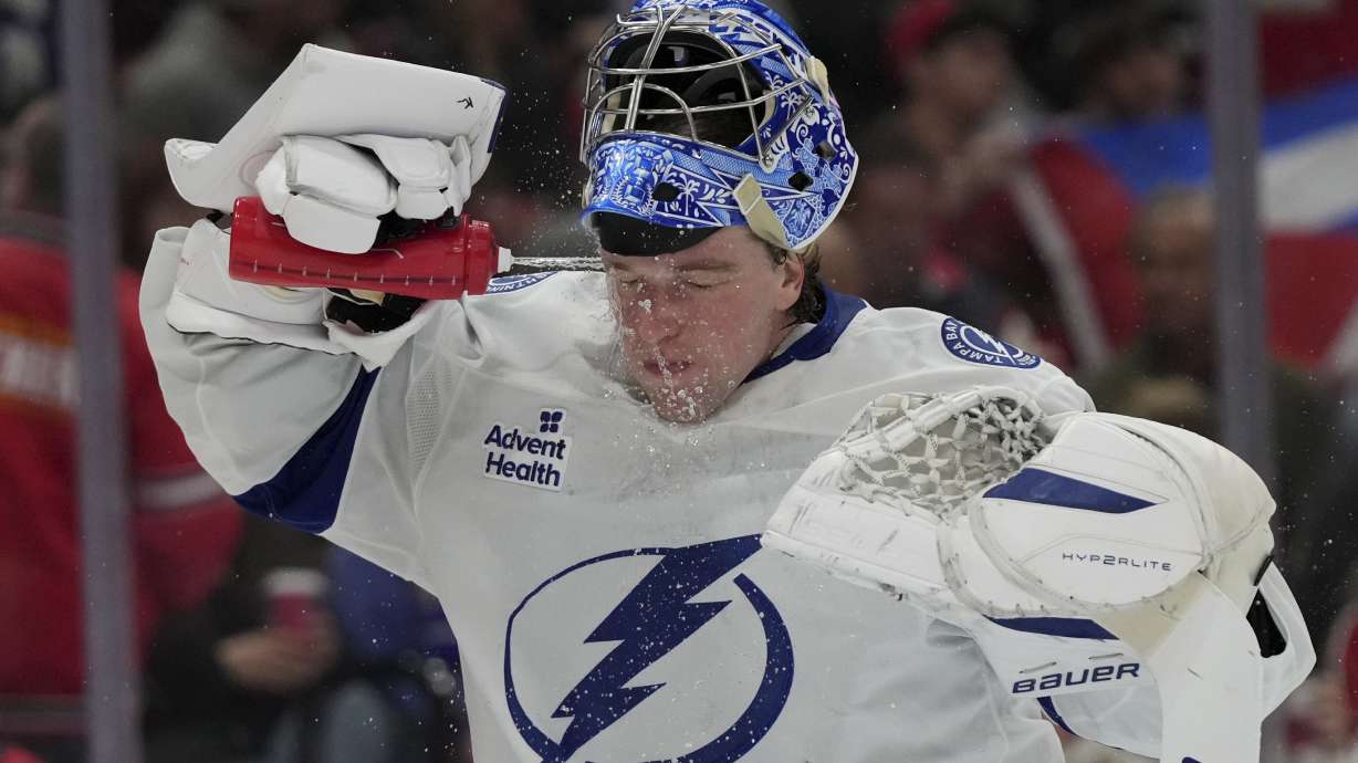 Tampa Bay Lightning goaltender Andrei Vasilevskiy spray water on on his face during the second period of an NHL hockey game against the Florida Panthers Monday, March 3, 2025, in Sunrise, Fla.