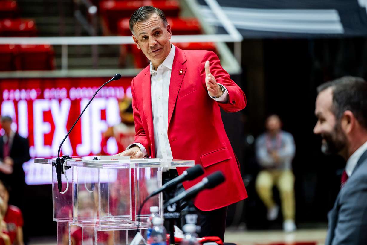 Utah Director of Athletics Mark Harlan speaks at a press conference to introduce Alex Jensen, right, as the new head coach for the University of Utah men's basketball team at the Jon M. Huntsman Center in Salt Lake City on Monday, March 17, 2025.