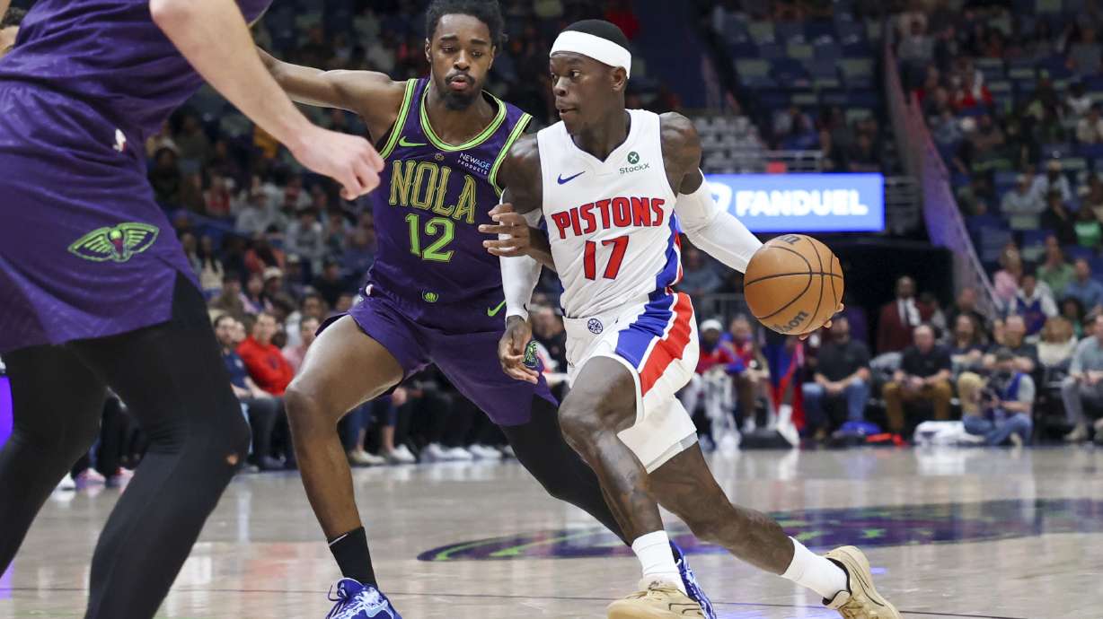 Detroit Pistons guard Dennis Schroeder (17) tries to drive past New Orleans Pelicans guard Antonio Reeves (12) in the second half of an NBA basketball game in New Orleans, Monday, March 17, 2025.