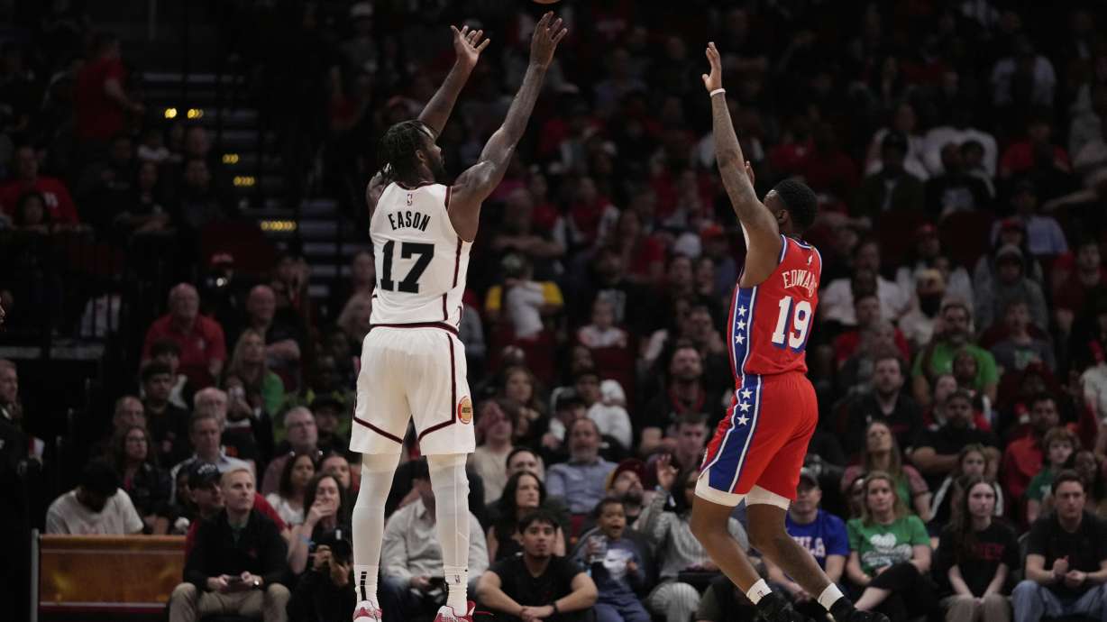 Houston Rockets forward Tari Eason (17) shoots against Philadelphia 76ers forward Justin Edwards (19) during the first half of an NBA basketball game in Houston, Monday, March 17, 2025.