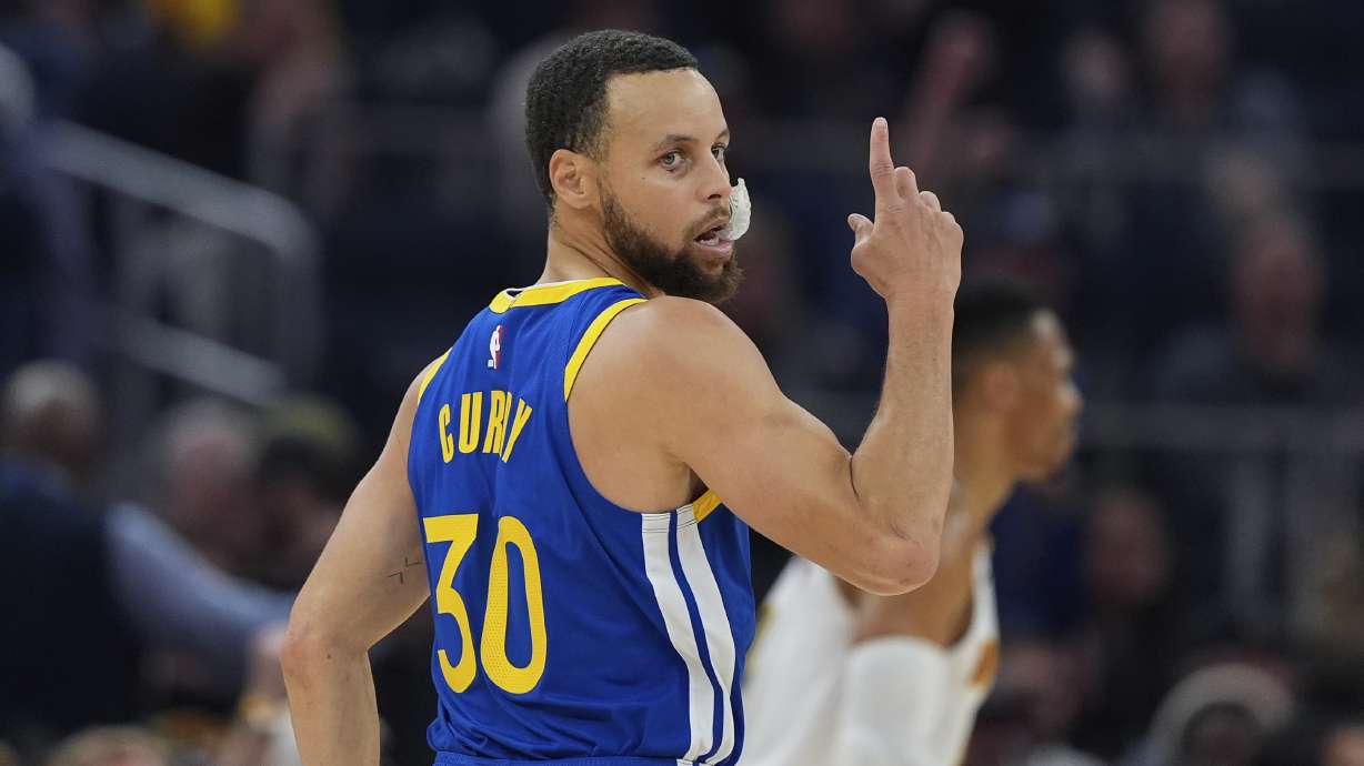 Golden State Warriors guard Stephen Curry reacts after making a 3-point basket during the first half of an NBA basketball game against the Denver Nuggets, Monday, March 17, 2025, in San Francisco.
