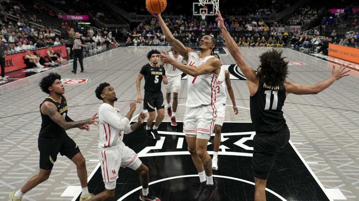 Houston guard Milos Uzan (7) puts up a shot during the second half of an NCAA college basketball game against Colorado in the Big 12 men's tournament Thursday, March 13, 2025, in Kansas City, Mo.