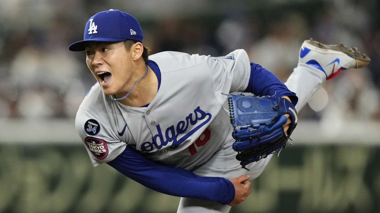 Los Angeles Dodgers starting pitcher Yoshinobu Yamamoto throws to the Chicago Cubs in the fifth inning of an MLB Japan Series baseball game in Tokyo, Japan, Tuesday, March 18, 2025.