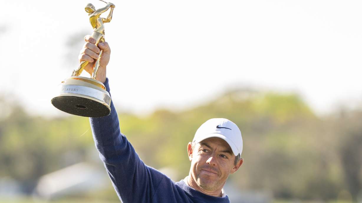 Rory McIlroy, of Northern Ireland, reacts during a trophy ceremony after winning a playoff round of The Players Championship golf tournament Monday, March 17, 2025, in Ponte Vedra Beach, Fla.