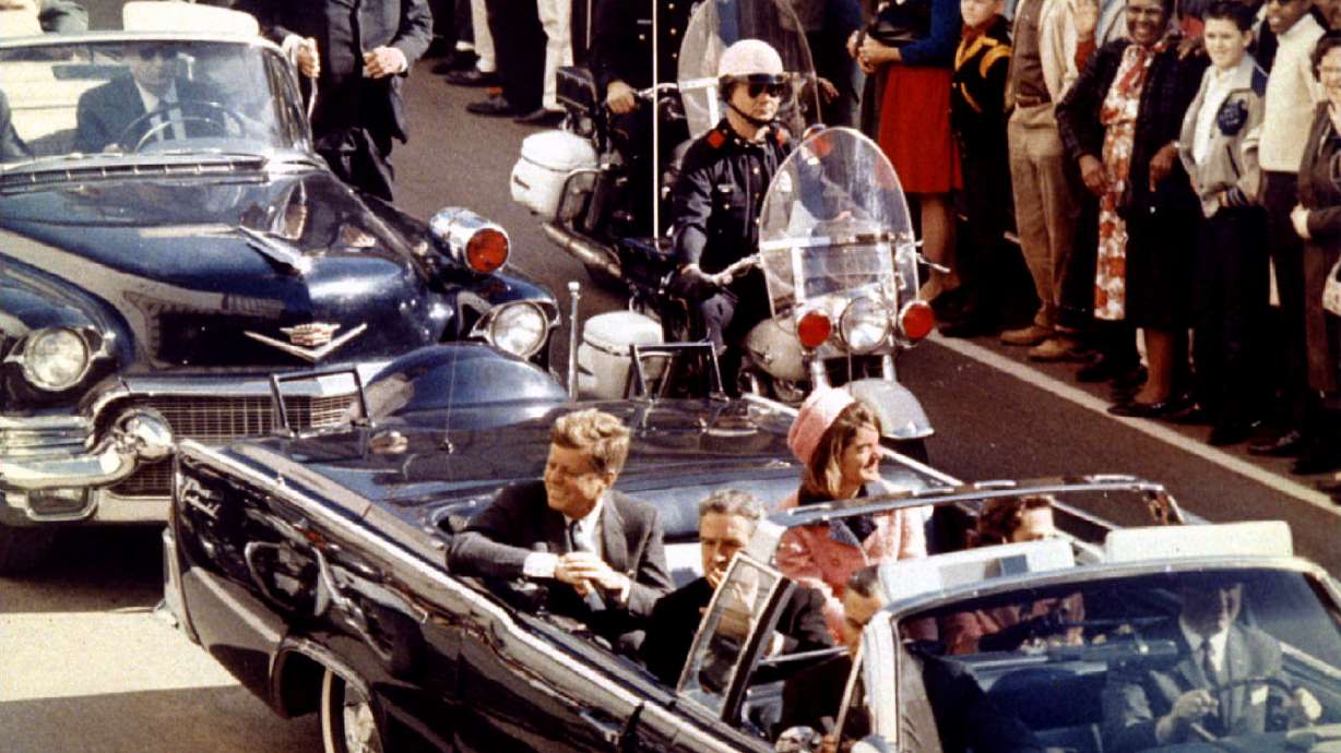President John F. Kennedy, Jacqueline Kennedy and Texas Gov. John Connally ride through Dallas moments before Kennedy was assassinated, Nov. 22, 1963. Justice Department lawyers are reviewing related documents before an anticipated Tuesday release.