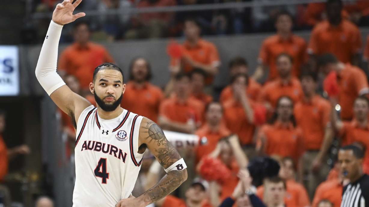 Auburn forward/center Johni Broome (4) celebrates by getting the crowd pumped during the second half an NCAA college basketball game against Georgia, Saturday, Feb. 22, 2025, in Auburn, Ala.
