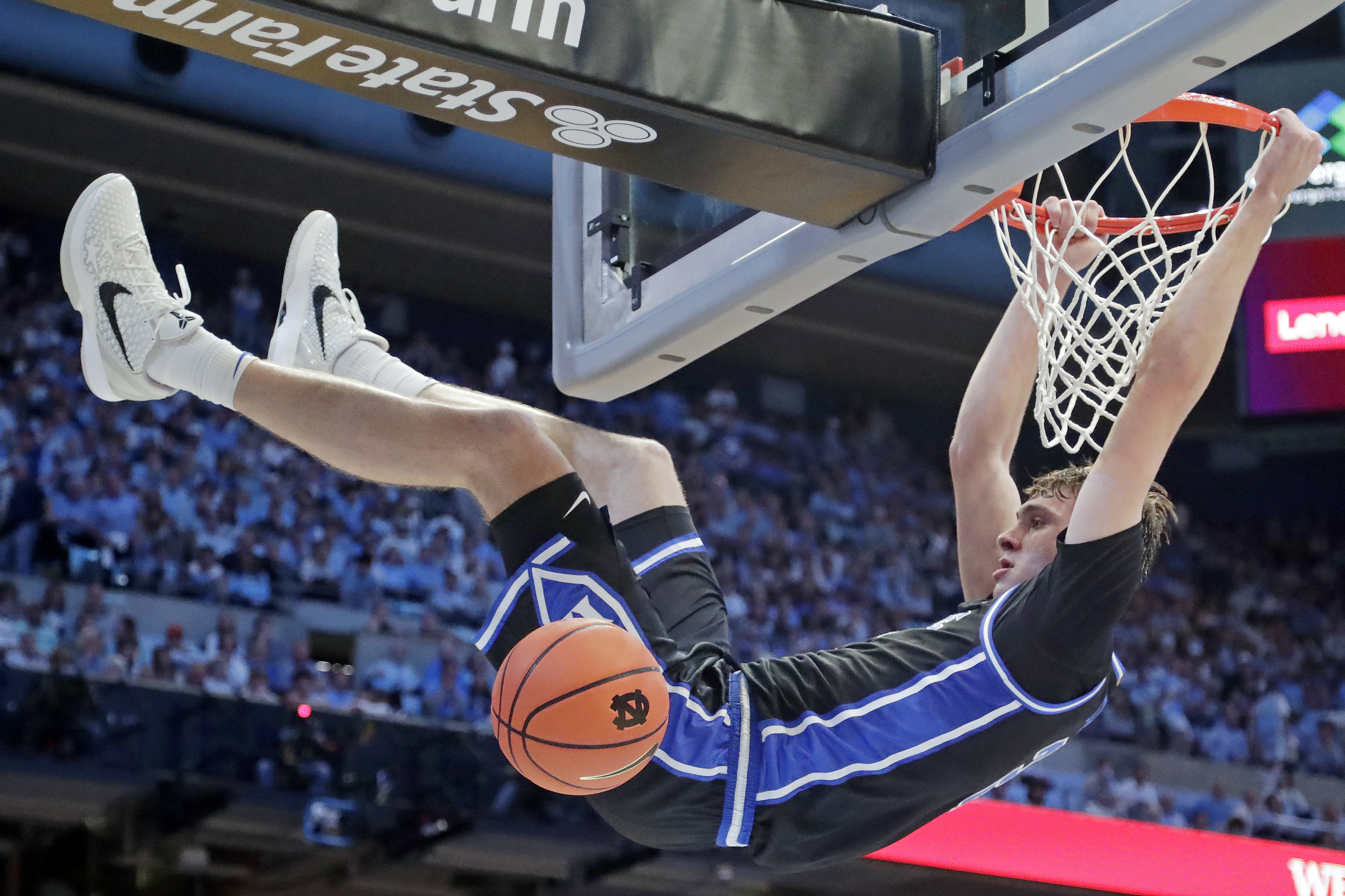 Duke forward Cooper Flagg (2) dunks during the second half of an NCAA college basketball game against North Carolina, Saturday, March 8, 2025, in Chapel Hill, N.C.