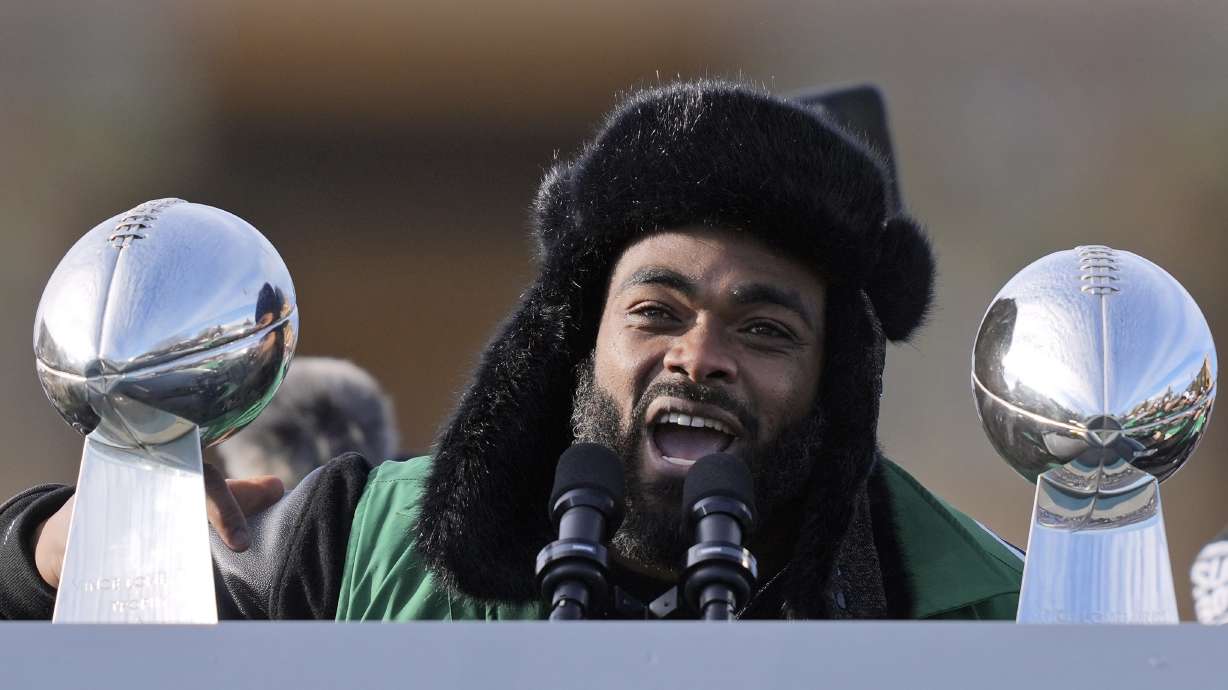 FILE - Philadelphia Eagles defensive end Brandon Graham speaks during the team's NFL football Super Bowl 59 parade and celebration, Friday, Feb. 14, 2025, in Philadelphia.