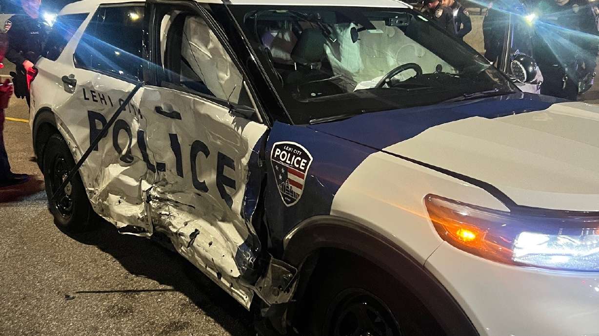 A Lehi police officer received minor injuries after being hit by a woman who ran a red light at Triumph Boulevard and Thanksgiving Way in Lehi on Sunday.